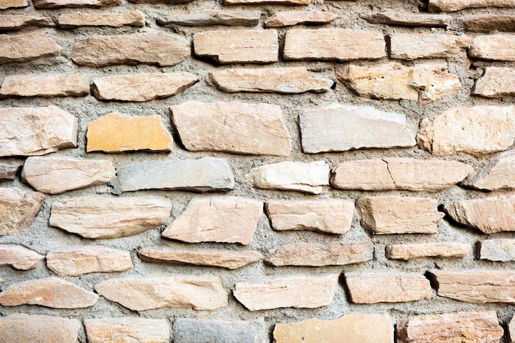 wall-broken-stones-with-copy-space-background_24837-669