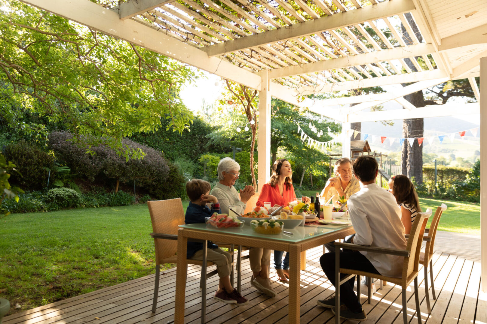 Family meal on shaded backyard patio