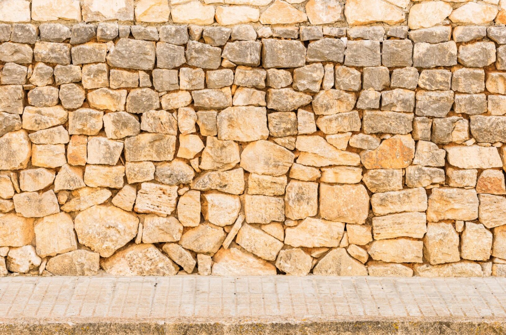 old-grunge-stone-wall-with-street-sidewalk-vintag-2026-01-11-09-25-12-utc