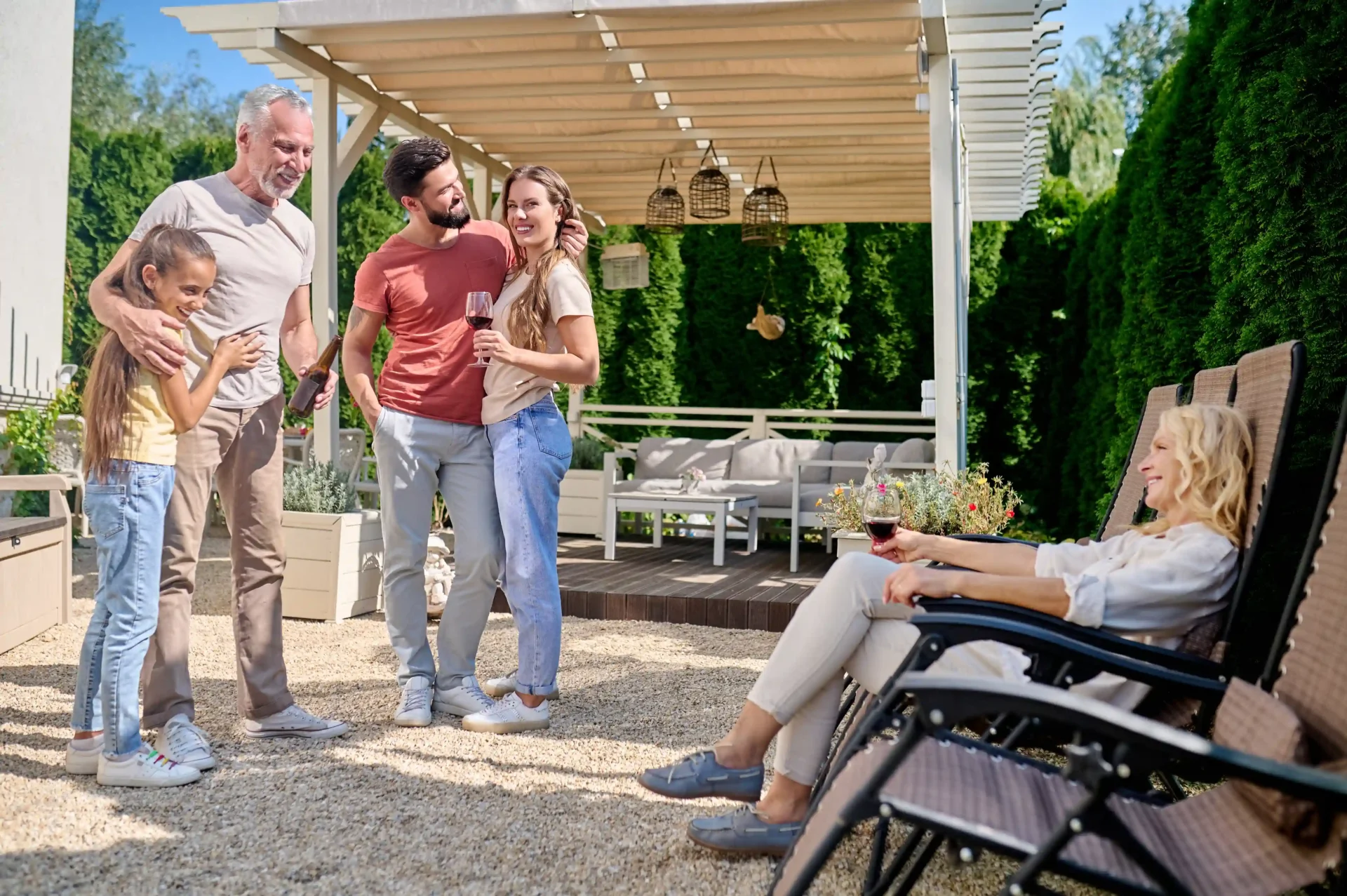 Multigenerational family enjoying drinks on patio